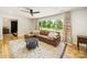 Spacious living room featuring hardwood floors, natural light, and modern decor at 1207 Carlson Dr, Monroe, NC 28110