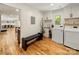 Functional mudroom with washer, dryer, utility sink, bench, and built-in cabinets offering ample storage at 1207 Carlson Dr, Monroe, NC 28110