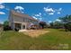 Spacious backyard with a gazebo, patio, and well-maintained lawn, perfect for outdoor activities at 12802 Waterlyn Club Dr, Charlotte, NC 28278