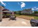 Spacious backyard with a large patio, gazebo, and well-maintained lawn, perfect for outdoor entertaining at 12802 Waterlyn Club Dr, Charlotte, NC 28278