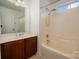 Bathroom with tub/shower combo, vanity with sink, and neutral color scheme at 12802 Waterlyn Club Dr, Charlotte, NC 28278