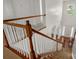 Inviting entryway featuring hardwood floors, a high ceiling, and a staircase with white spindles and a wooden banister at 12802 Waterlyn Club Dr, Charlotte, NC 28278
