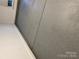 Epoxy garage flooring with a speckled design enhances this home's utility and style at 12802 Waterlyn Club Dr, Charlotte, NC 28278
