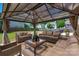 Beautiful gazebo featuring comfortable seating, creating an inviting outdoor space for relaxation at 12802 Waterlyn Club Dr, Charlotte, NC 28278