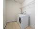 Efficient laundry room with white washer and dryer, providing convenience and functionality at 12802 Waterlyn Club Dr, Charlotte, NC 28278