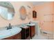 The bathroom features dual vanities, a medicine cabinet, and tiled flooring at 135 Meadow Lake Dr, Salisbury, NC 28146