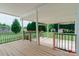Spacious outdoor deck with railing and a view of the expansive backyard at 135 Meadow Lake Dr, Salisbury, NC 28146