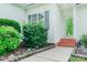 Close up of the front entrance with brick steps and decorative landscaping at 135 Meadow Lake Dr, Salisbury, NC 28146
