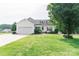 Charming one story home with well maintained lawn and landscaped garden beds at 135 Meadow Lake Dr, Salisbury, NC 28146