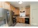 Well-equipped kitchen featuring stainless steel appliances and wooden cabinetry at 135 Meadow Lake Dr, Salisbury, NC 28146