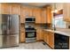 Well-equipped kitchen featuring stainless steel appliances and wooden cabinetry at 135 Meadow Lake Dr, Salisbury, NC 28146