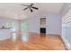 Spacious living room featuring hardwood floors, fireplace, and vaulted ceiling at 135 Meadow Lake Dr, Salisbury, NC 28146