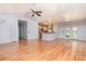 Open-concept living room showcasing hardwood floors and seamless flow to the kitchen at 135 Meadow Lake Dr, Salisbury, NC 28146