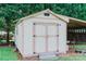 Outdoor storage shed with double doors and a covered space at 135 Meadow Lake Dr, Salisbury, NC 28146