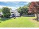 Well-maintained backyard with lush greenery and mature trees, offering privacy at 13612 Bolingbrook Ln, Charlotte, NC 28273