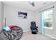 Bedroom featuring a bean bag chair, a rolling chair, and a window with neutral walls at 13612 Bolingbrook Ln, Charlotte, NC 28273