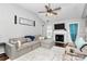 Spacious living room with fireplace, wood floors, and comfortable seating arrangements at 13612 Bolingbrook Ln, Charlotte, NC 28273