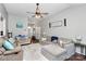 Spacious living room boasts ample seating, wood floors, and a charming ceiling fan at 13612 Bolingbrook Ln, Charlotte, NC 28273