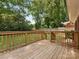 Spacious wooden deck offering views of the lush backyard and surrounding greenery at 1422 Burnley Rd, Charlotte, NC 28210