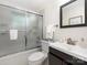 Clean bathroom with tiled shower, modern vanity, and neutral decor at 1422 Burnley Rd, Charlotte, NC 28210