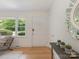 Inviting entryway with hardwood floors, white walls, and natural light at 1422 Burnley Rd, Charlotte, NC 28210