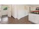 Traditional kitchen with tiled floors, white cabinets, and stainless steel appliances at 1422 Burnley Rd, Charlotte, NC 28210