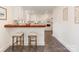 Kitchen featuring white cabinets, breakfast bar and tiled floor at 1422 Burnley Rd, Charlotte, NC 28210
