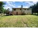A spacious backyard featuring a deck, a shed, and ample green space for outdoor activities at 154 Seven Oaks Ln, Statesville, NC 28677