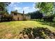 A vast backyard featuring a storage shed and lush green grass, perfect for outdoor activities and relaxation at 154 Seven Oaks Ln, Statesville, NC 28677