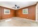 Bedroom featuring neutral walls, ceiling fan, and natural light from two windows at 154 Seven Oaks Ln, Statesville, NC 28677