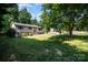 Charming home set on a lush lot offering mature trees and a well-kept lawn at 154 Seven Oaks Ln, Statesville, NC 28677