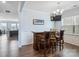 Stylish home bar area with wooden bar, stools, a wall-mounted TV and hardwood floors at 16038 Harbor Hill Dr, Charlotte, NC 28273