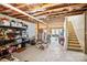 Spacious unfinished basement with exposed beams, concrete floor, and staircase; ready for customization at 16038 Harbor Hill Dr, Charlotte, NC 28273