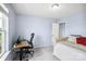 Bedroom with a computer desk, natural light, and a stylish bed in a cozy setting at 16038 Harbor Hill Dr, Charlotte, NC 28273