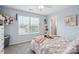 Cozy bedroom with natural light from the window and a comfortable bed with a pink throw at 16038 Harbor Hill Dr, Charlotte, NC 28273