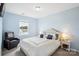 Cozy bedroom with a comfortable chair and natural light streaming through the window at 16038 Harbor Hill Dr, Charlotte, NC 28273