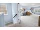 Upstairs bonus room with neutral carpet and natural light at 16038 Harbor Hill Dr, Charlotte, NC 28273
