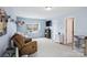 Bright bonus room with a comfortable seating area, built-in window seat, and neutral walls at 16038 Harbor Hill Dr, Charlotte, NC 28273