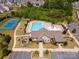 Resort-style community pool with swimming lanes, a kid friendly pool area, tennis court and playground for recreation at 16038 Harbor Hill Dr, Charlotte, NC 28273