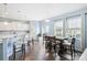 Bright dining area with wood floors, large windows and modern white trim at 16038 Harbor Hill Dr, Charlotte, NC 28273