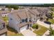 Charming two-story home with a well-manicured lawn, stone accents, and an attached garage provides curb appeal at 16038 Harbor Hill Dr, Charlotte, NC 28273