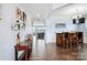 Long hallway with elegant décor, chair rail detail, bar area, and access to living room at 16038 Harbor Hill Dr, Charlotte, NC 28273