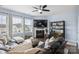 Comfortable living room with a fireplace, large windows, and plush seating at 16038 Harbor Hill Dr, Charlotte, NC 28273