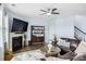 Inviting living room features a cozy fireplace, modern furnishings, and plenty of natural light at 16038 Harbor Hill Dr, Charlotte, NC 28273