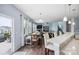Open living area with breakfast bar, dining area and staircase at 16038 Harbor Hill Dr, Charlotte, NC 28273