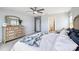 Spacious main bedroom showcasing a dresser, ceiling fan, and modern decor at 16038 Harbor Hill Dr, Charlotte, NC 28273