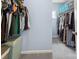 Organized walk-in closet featuring ample hanging space and stylish storage solutions at 16038 Harbor Hill Dr, Charlotte, NC 28273