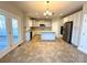 Open-concept kitchen with an island, stainless steel appliances, and ample counter space, perfect for culinary creations at 16446 Doves Canyon Ln, Charlotte, NC 28278