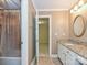 Full bathroom with tiled vanity and shower at 16511 Bridgehampton Club Dr, Charlotte, NC 28277