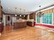 Well-equipped kitchen with stainless steel appliances, island, and natural light at 16511 Bridgehampton Club Dr, Charlotte, NC 28277